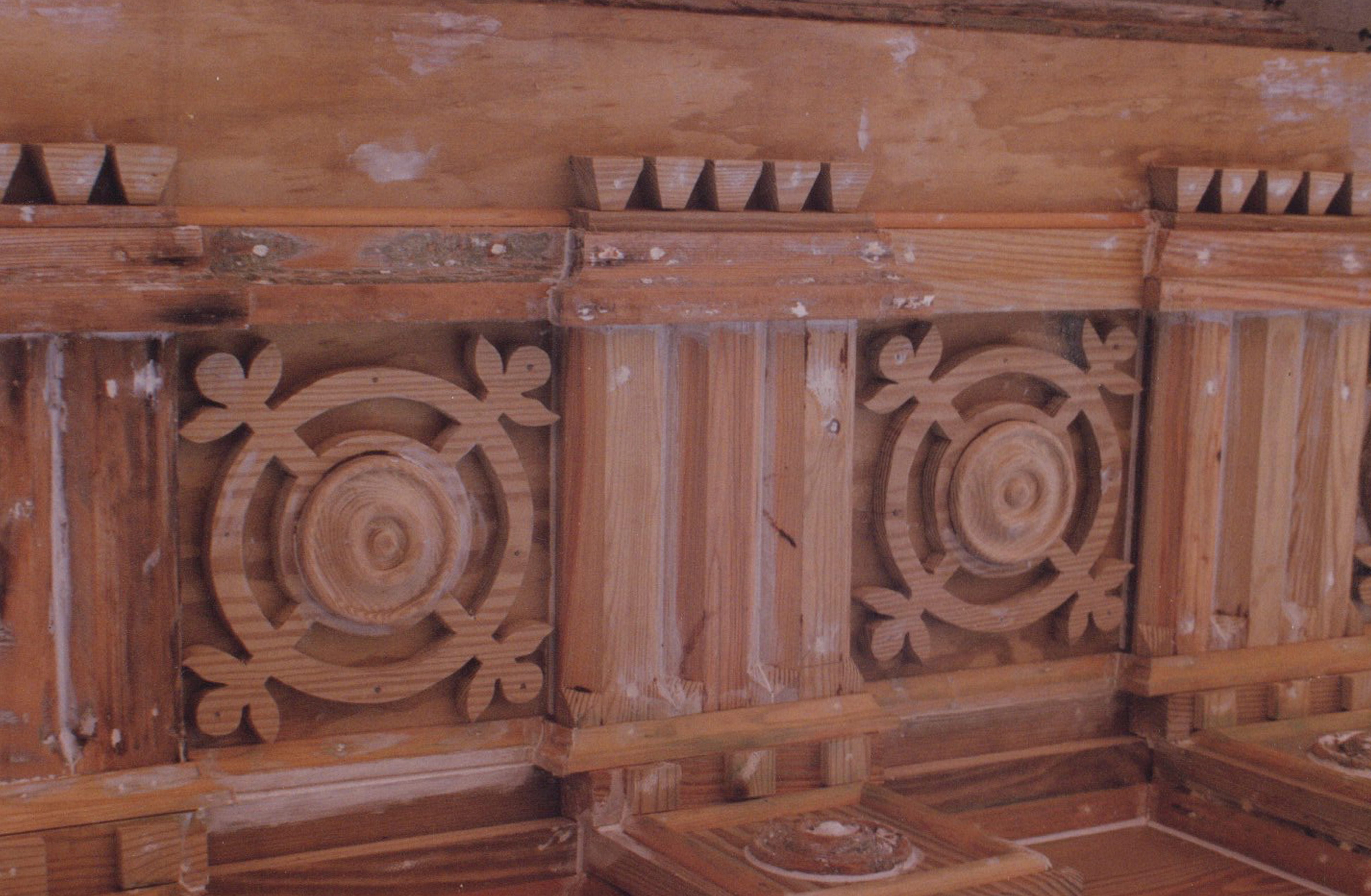 Detail of hand-carved ornamental woodwork repaired during restoration