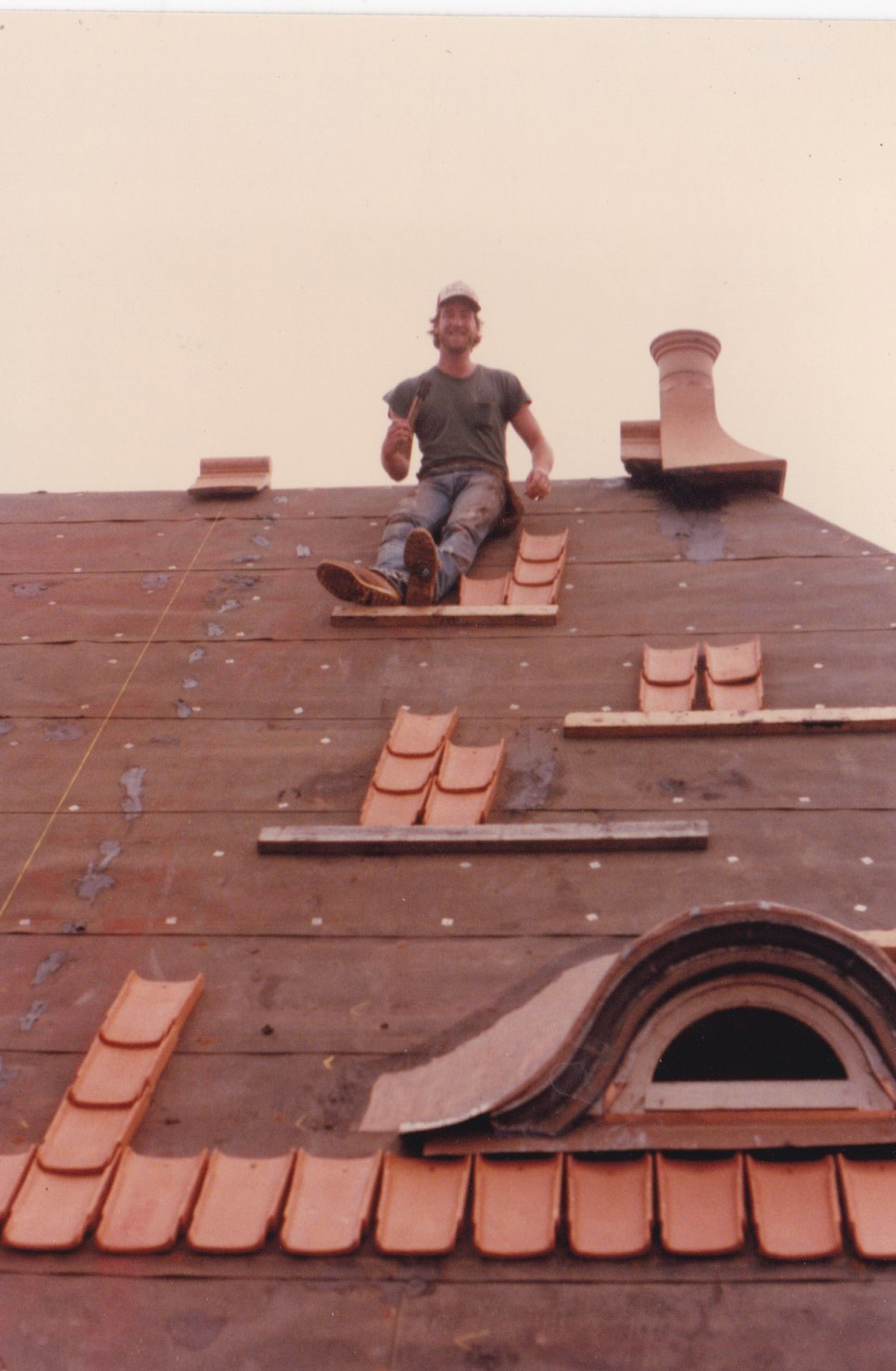 Handlaying clay roof tiles one at a time