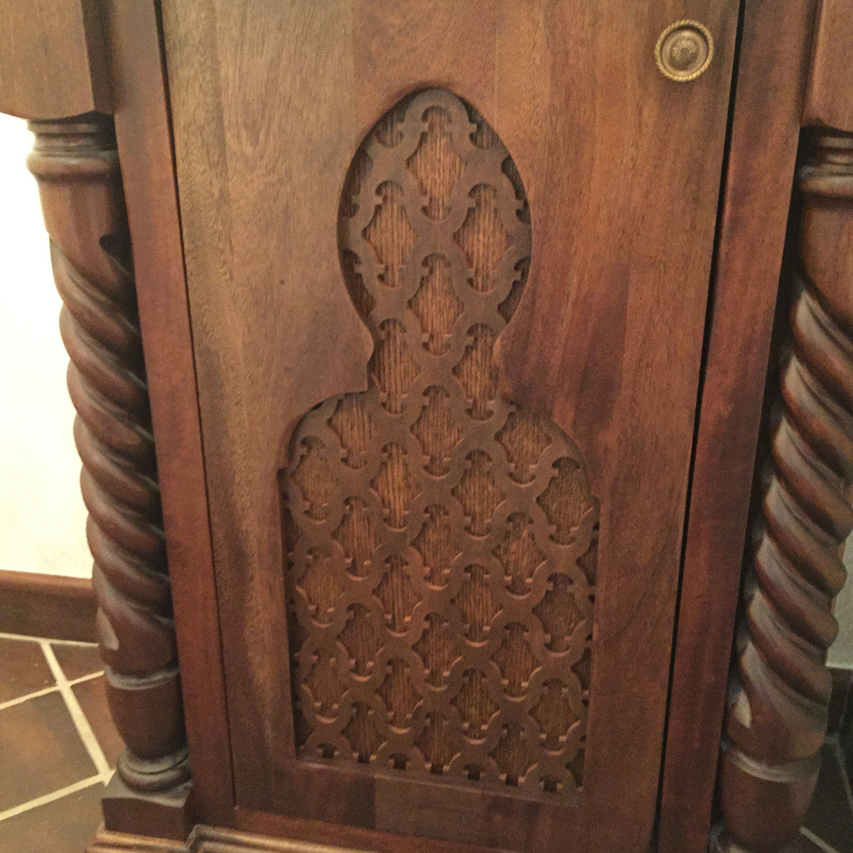 Ornate carved wood door panel with decorative relief