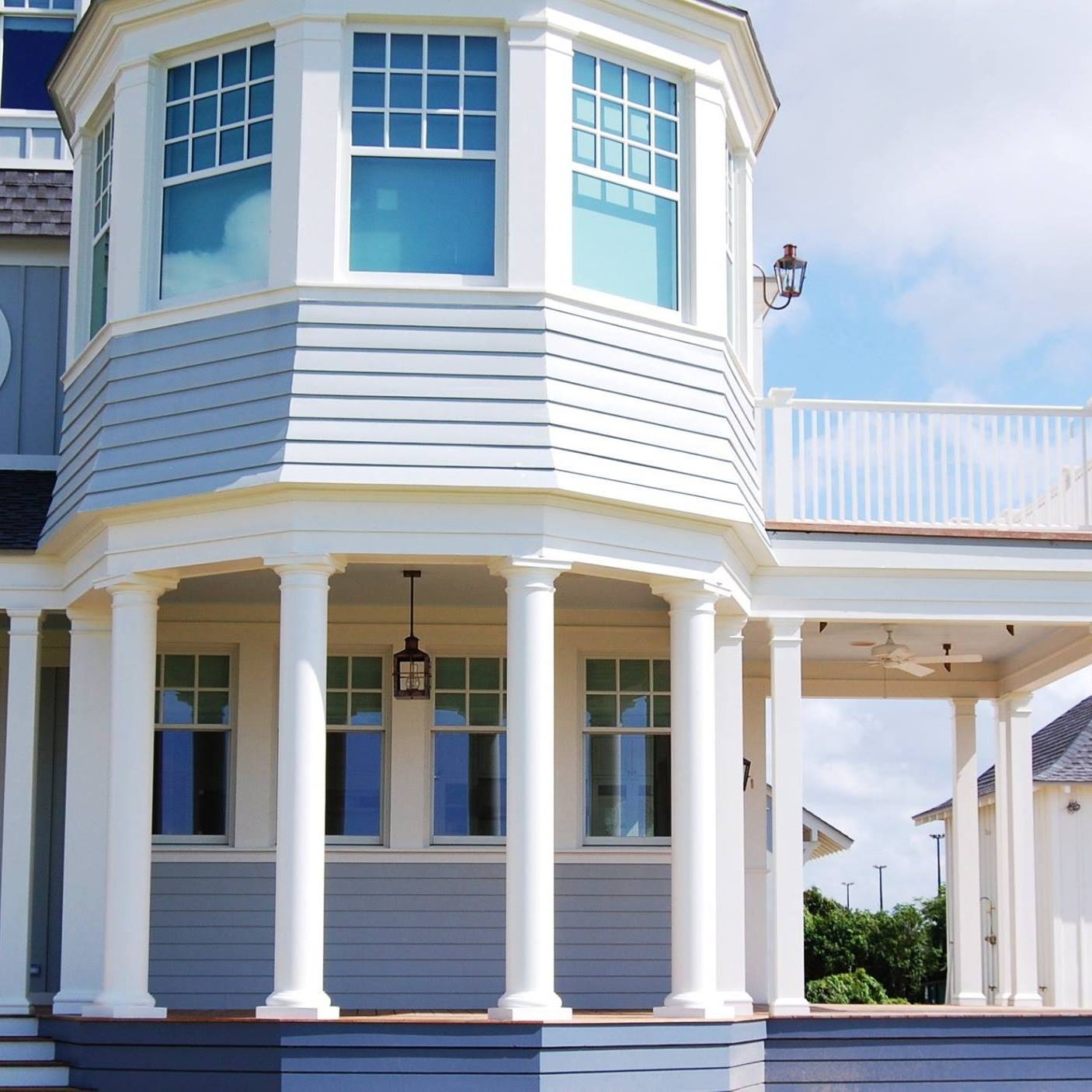 Blue-gray coastal home with octagonal bay window