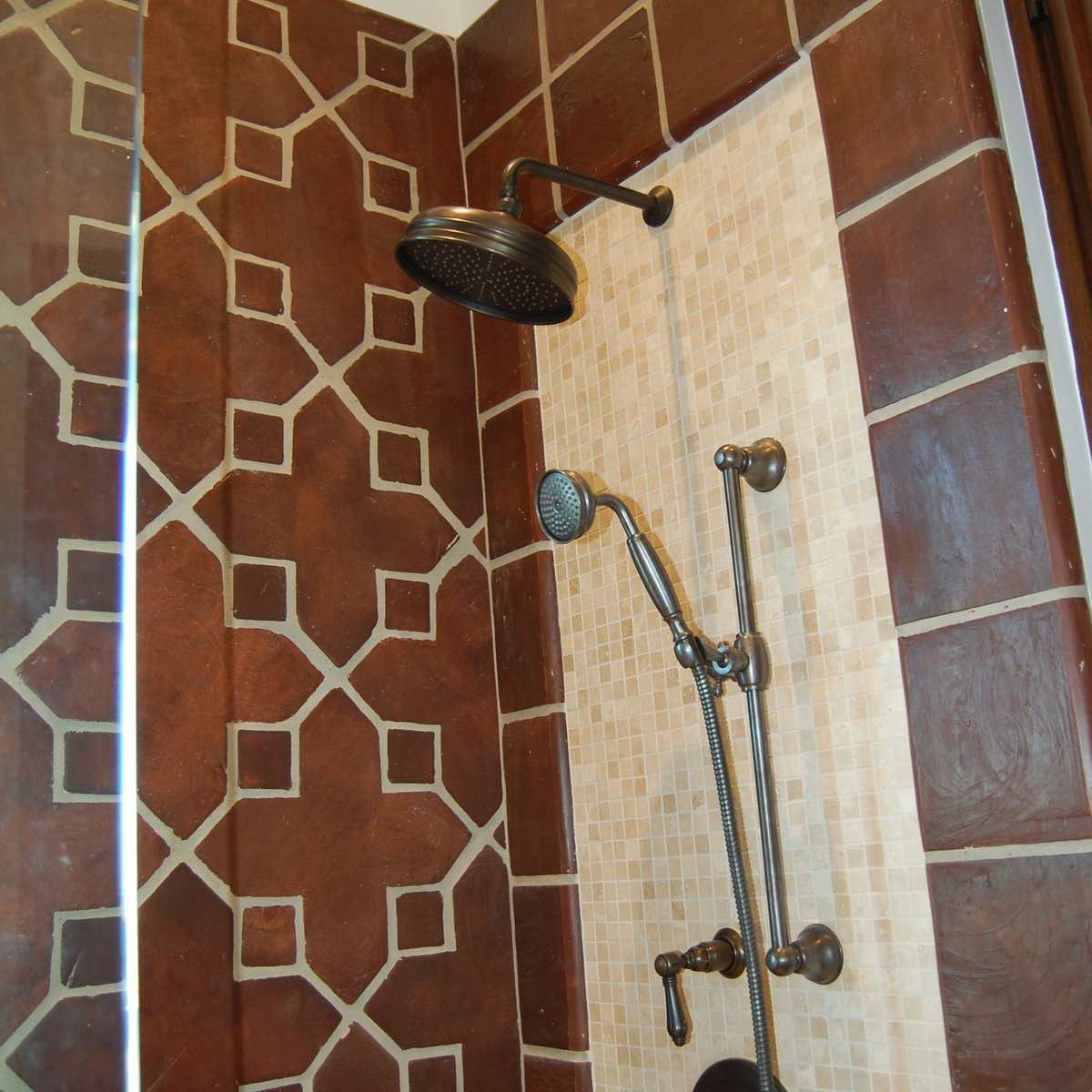 Custom shower with red and cream decorative tile