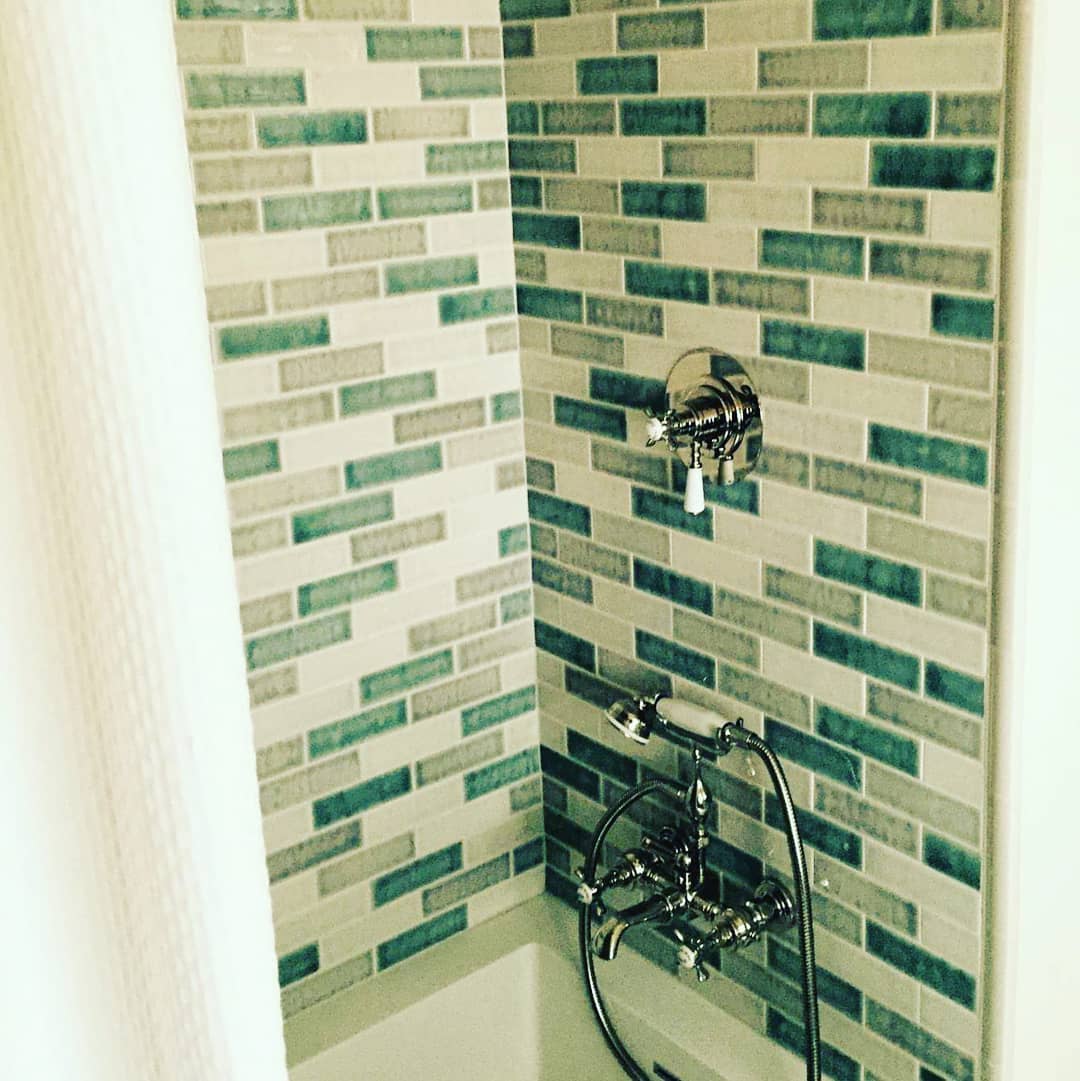 Custom shower with arabesque tile backsplash