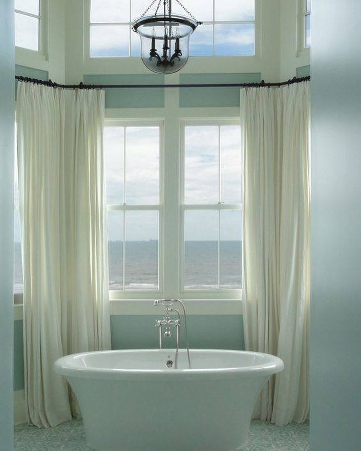 Coastal bathroom with freestanding tub and ocean views