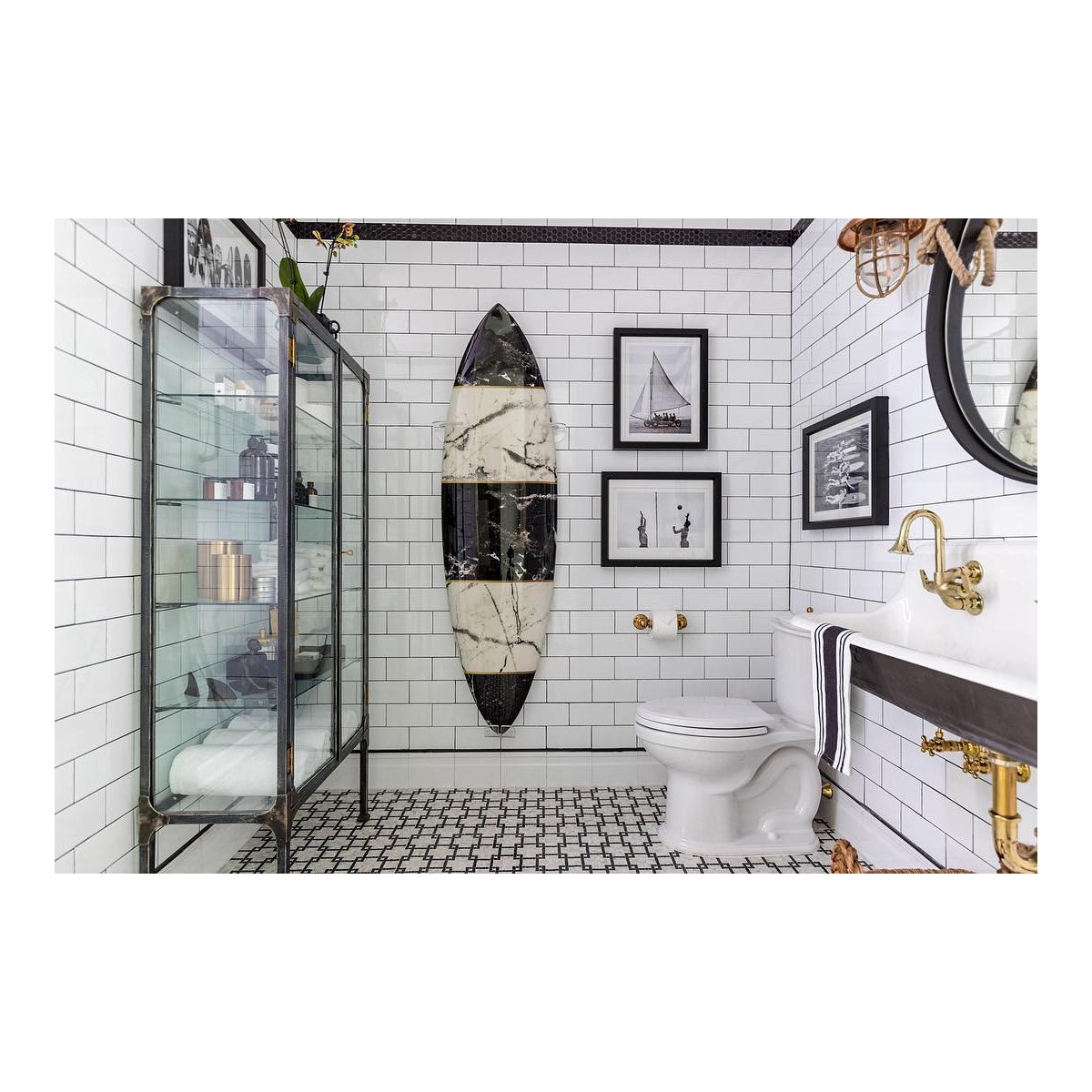 Nautical bathroom with subway tile and surfboard decor