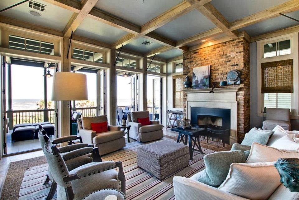 Coastal living room with brick fireplace and ocean views