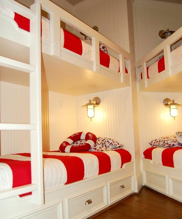 Nautical bunk room with red and white striped bedding