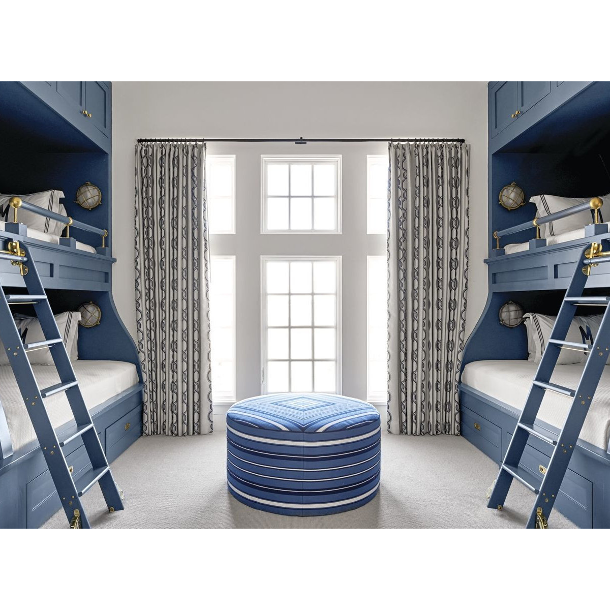 Custom built-in bunk beds in navy blue with nautical design