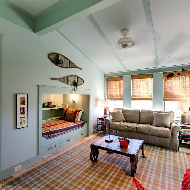Coastal living room with window seat and aqua walls