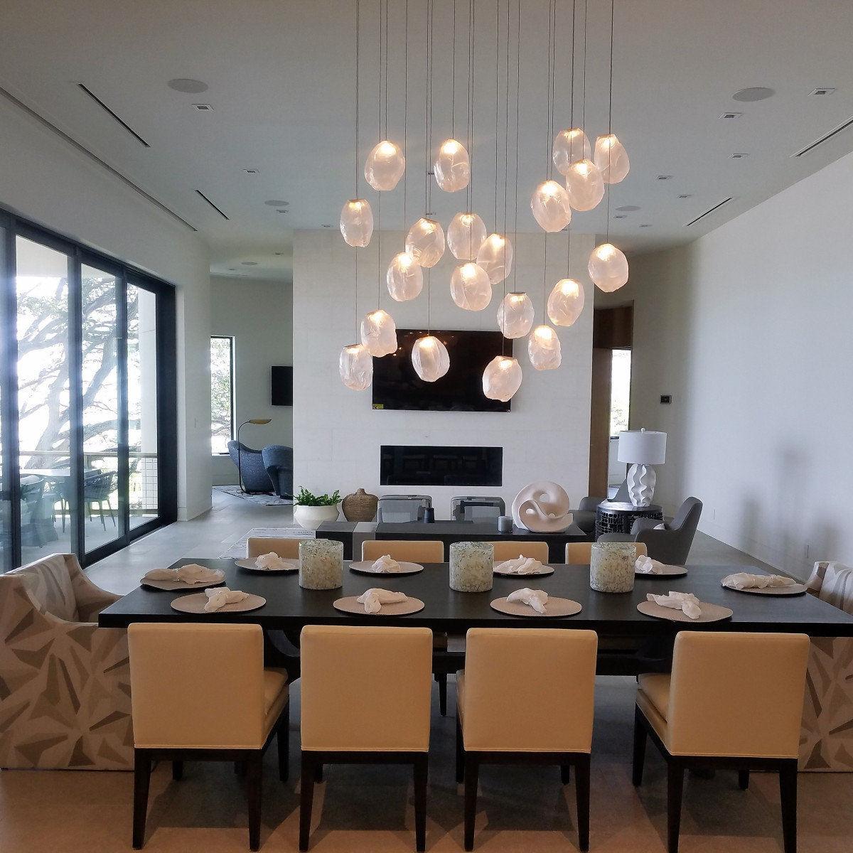 Contemporary dining room with pendant light cluster
