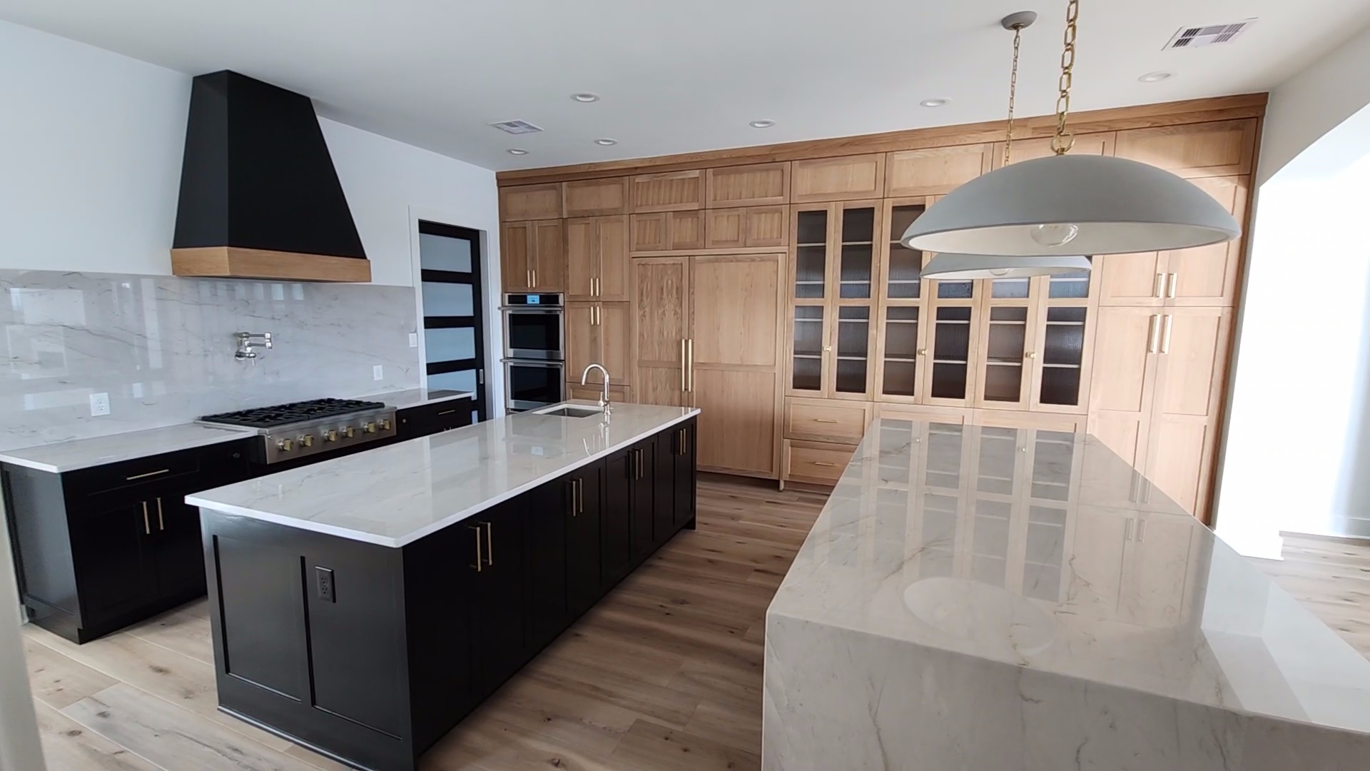 Modern two-tone kitchen with double islands