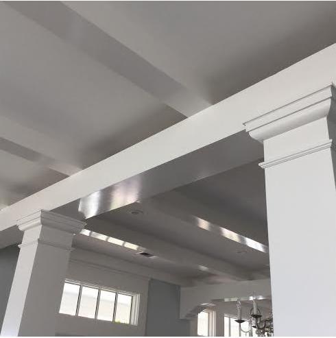 White coffered ceiling with columns and crown molding