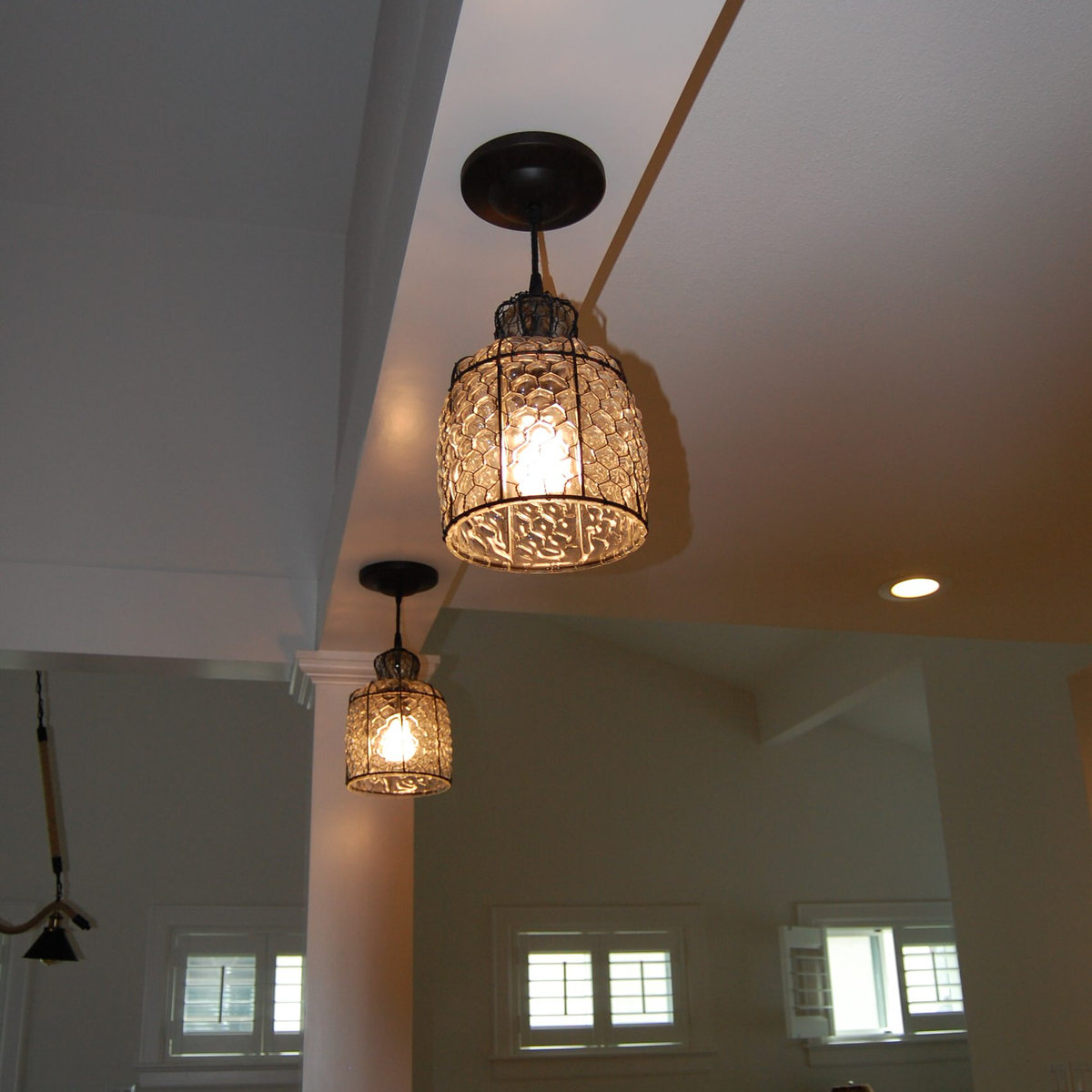 Decorative pendant fixtures in open ceiling space